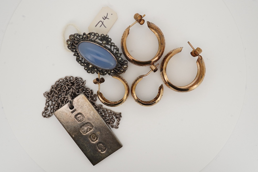 A pair of engraved 9ct gold hoop earrings, diameter 22mm, a similar smaller pair of 9ct gold, hoop earrings, gross 7 grams, together with a white metal, blue chalcedony and marcasite set brooch and a 1970's silver ingot